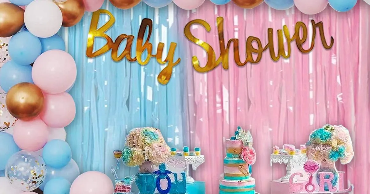 Mom-to-be holding baby shoes at a baby shower