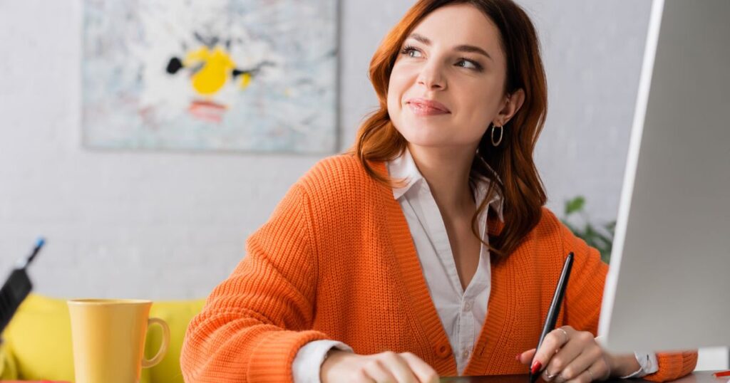 Successful graphic designer celebrating finished project