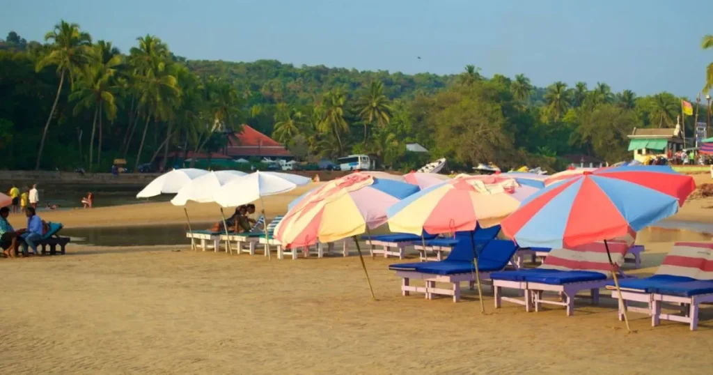 Baga Beach in Goa with tourists enjoying the sunny weather